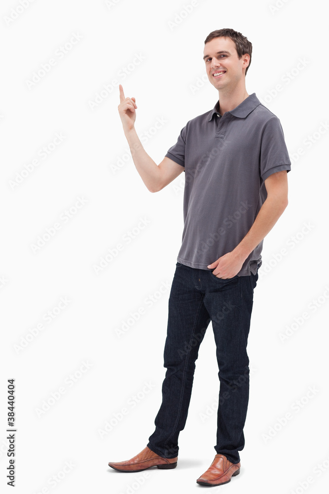 Happy man standing and presenting something above Happy man standing and presenting something above