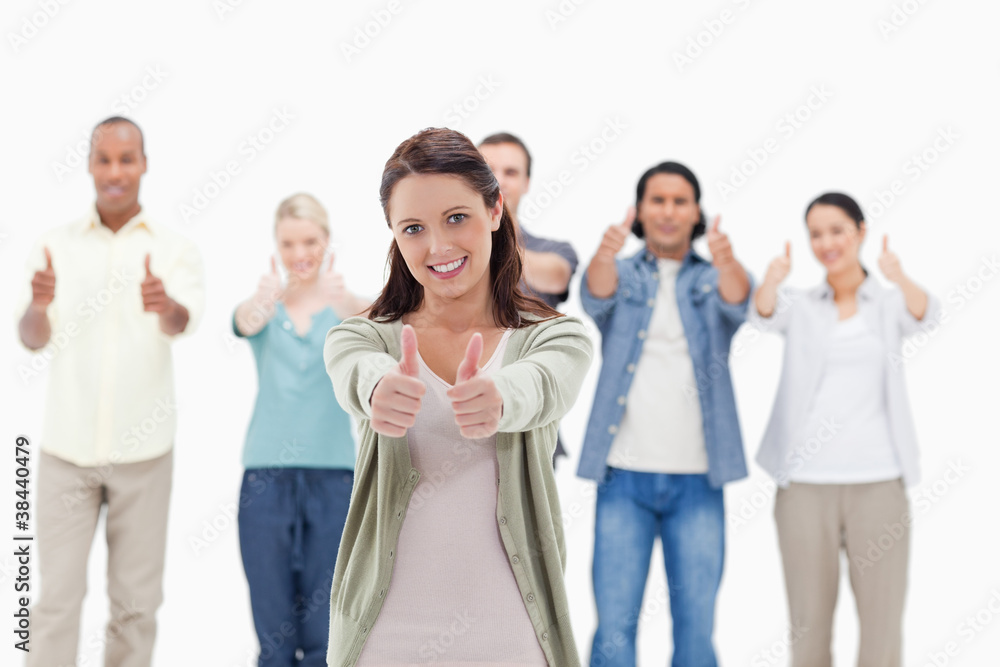Close-up of people with their thumbs-up Close-up of people with their thumbs-up
