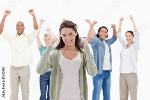 Happy people raising their arms