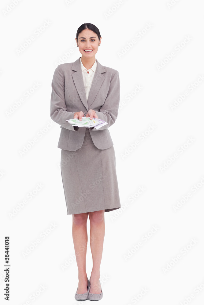 Smiling young businesswoman with bank notes in her hands Smiling young businesswoman with bank notes in her hands