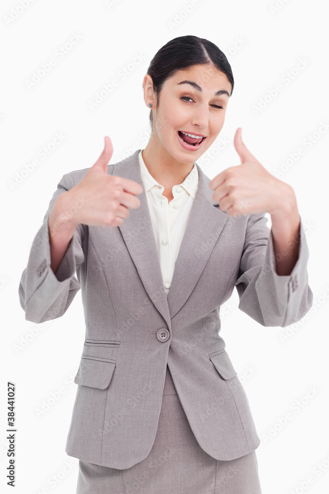 Cheering businesswoman giving thumbs up Cheering businesswoman giving thumbs up