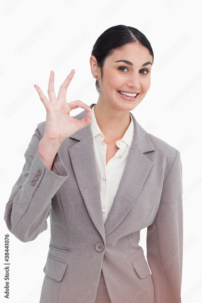 Young businesswoman giving approval Young businesswoman giving approval