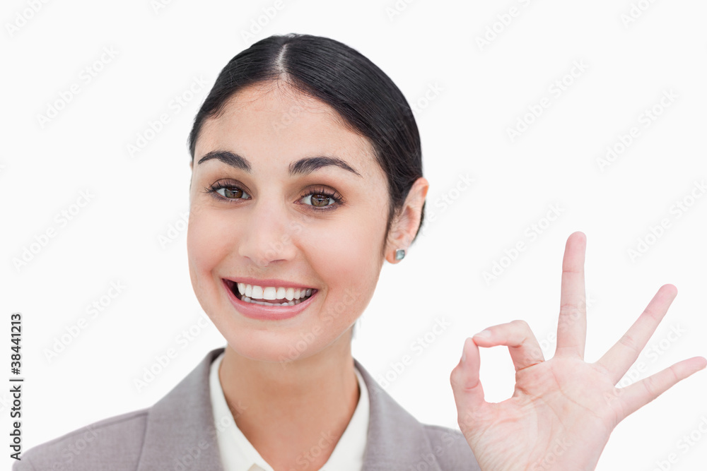 Close up of smiling businesswoman giving her approval Close up of smiling businesswoman giving her approval