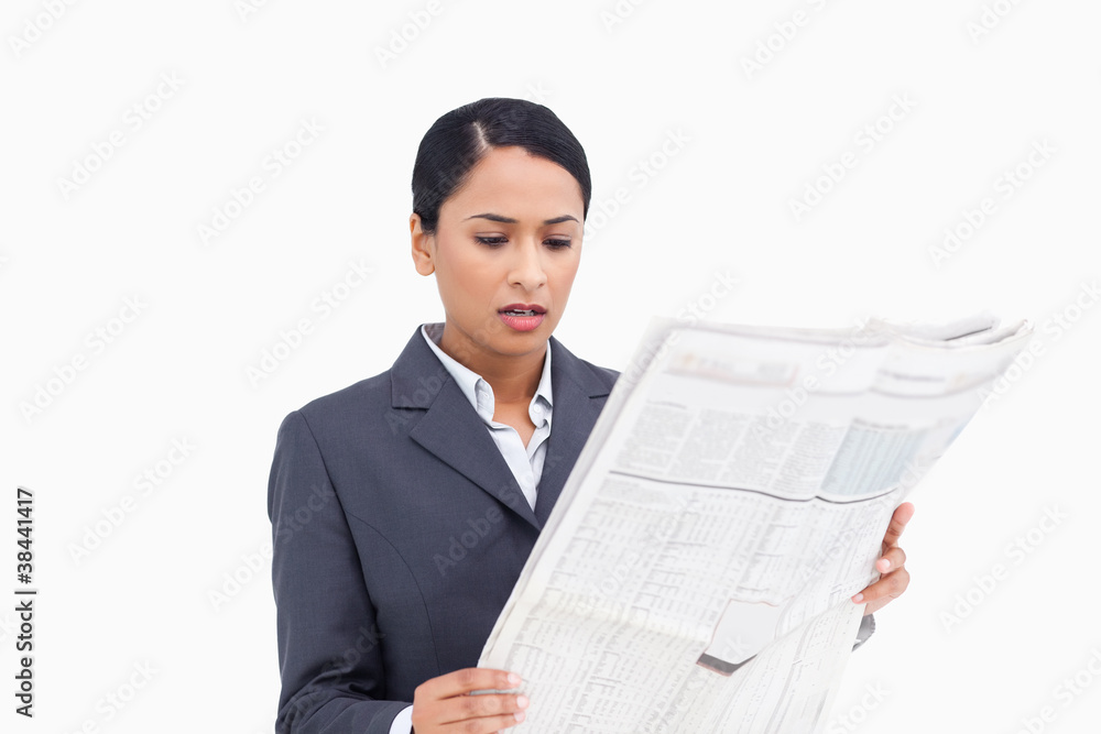 Close up of saleswoman reading news paper Close up of saleswoman reading news paper