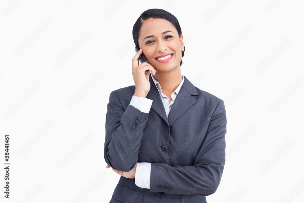 Close up of saleswoman on her mobile phone Close up of saleswoman on her mobile phone