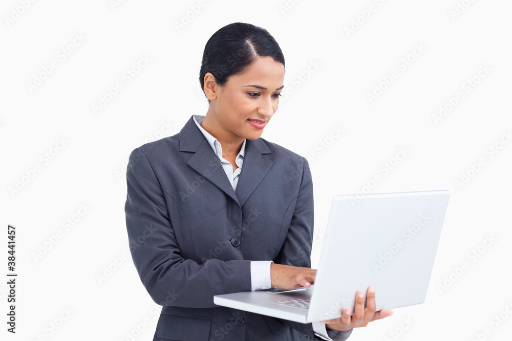 Close up of saleswoman using her laptop Close up of saleswoman using her laptop