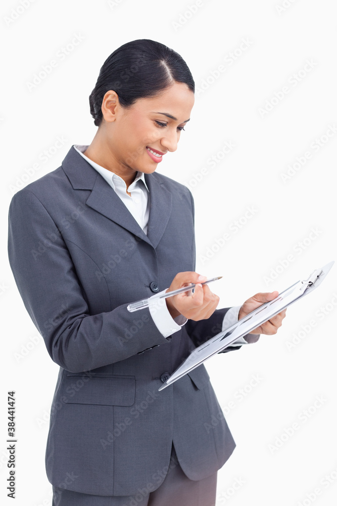 Close up of saleswoman with clipboard and pen