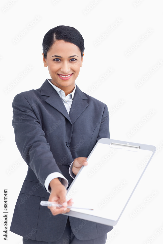 Close up of smiling saleswoman asking for signature Close up of smiling saleswoman asking for signature