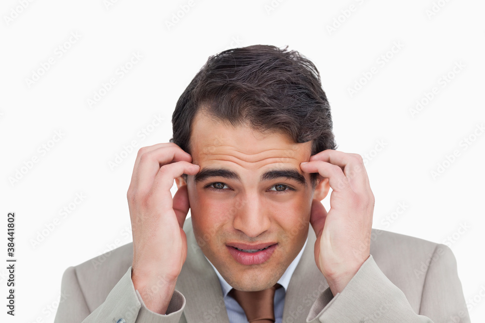 Close up of salesman experiencing a headache Close up of salesman experiencing a headache