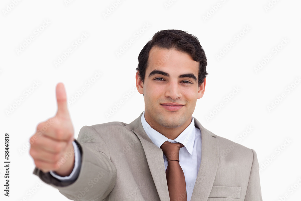 Close up of young salesman giving thumb up Close up of young salesman giving thumb up