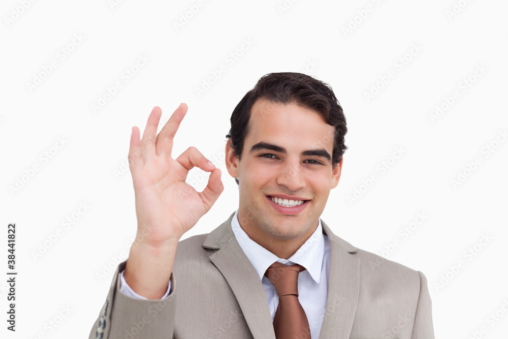 Close up of smiling salesman giving his approval Close up of smiling salesman giving his approval