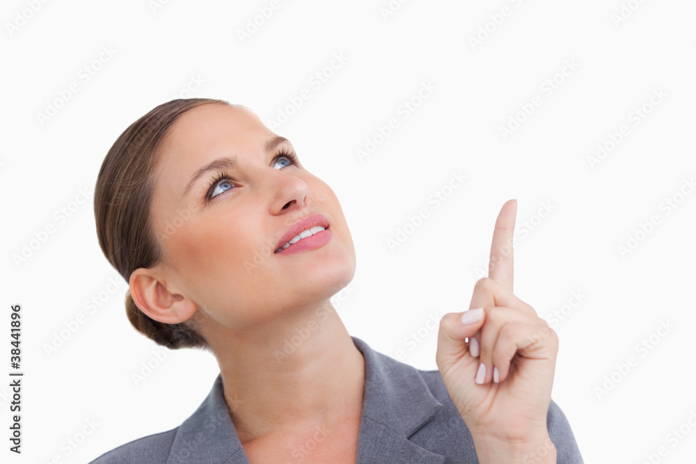 Close up of tradeswoman looking and pointing up Close up of tradeswoman looking and pointing up