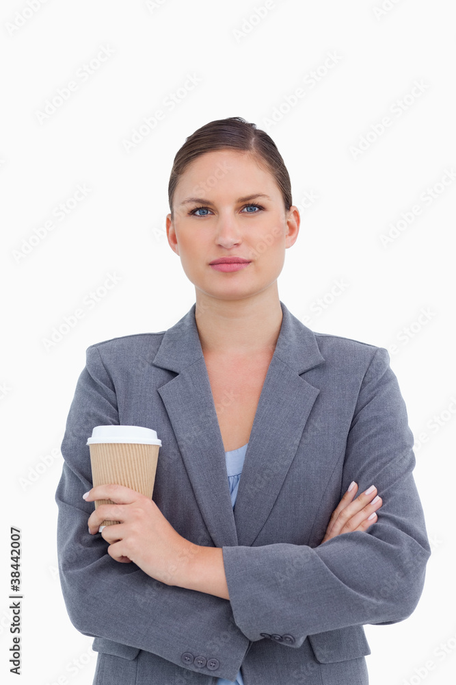Tradeswoman with arms folded and paper cup Tradeswoman with arms folded and paper cup