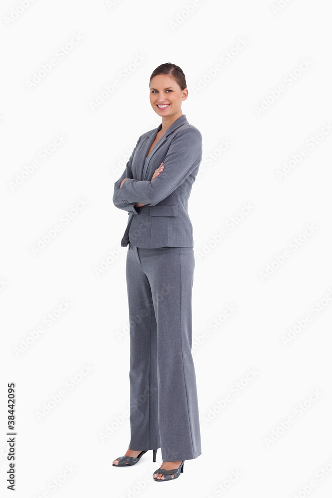 Side view of smiling tradeswoman with her arms folded Side view of smiling tradeswoman with her arms folded