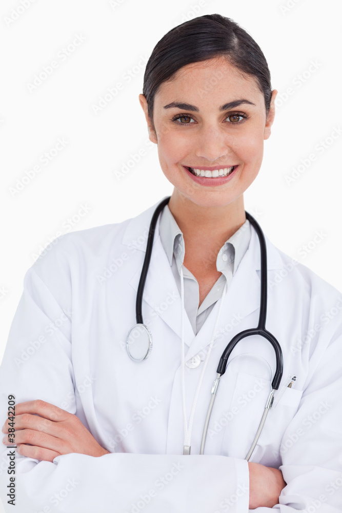 Close up of smiling female doctor with her arms folded