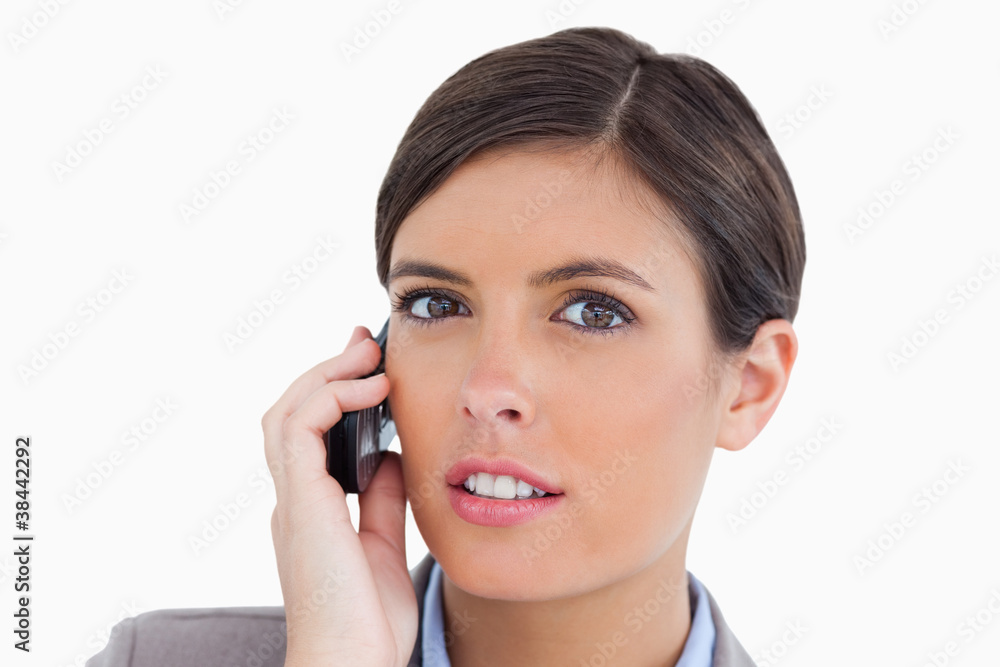 Close up of female entrepreneur talking on her cellphone Close up of female entrepreneur talking on her cellphone