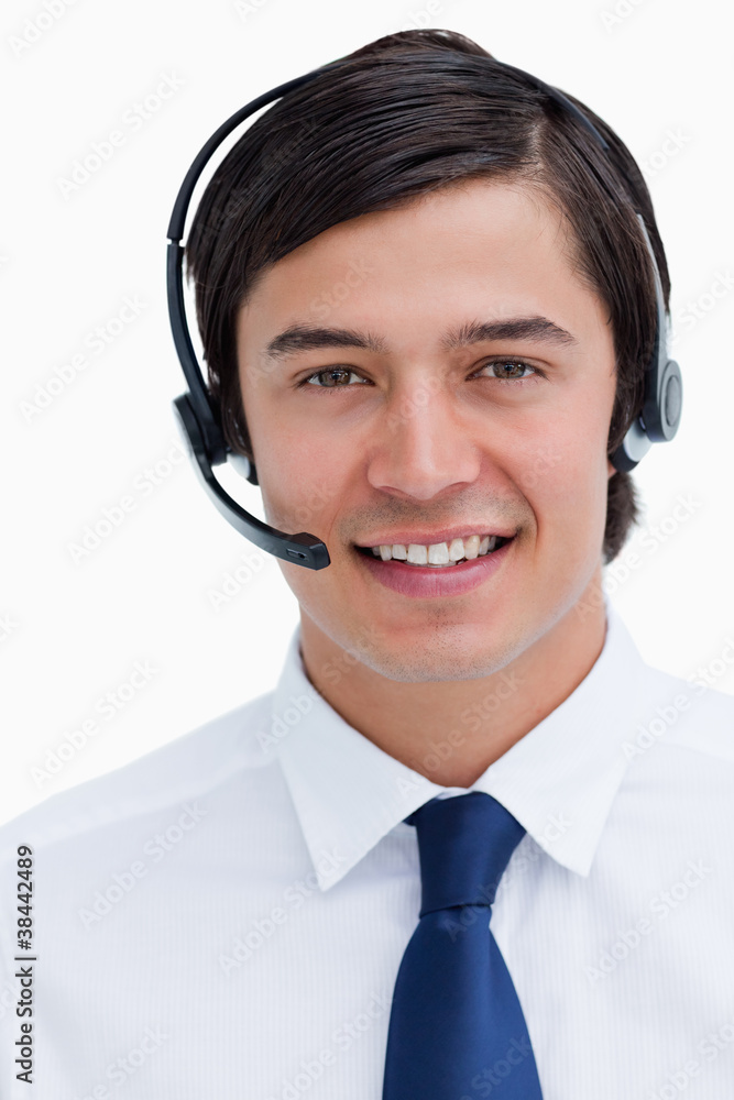 Close up of male telephone support employee with headset on Close up of male telephone support employee with headset on
