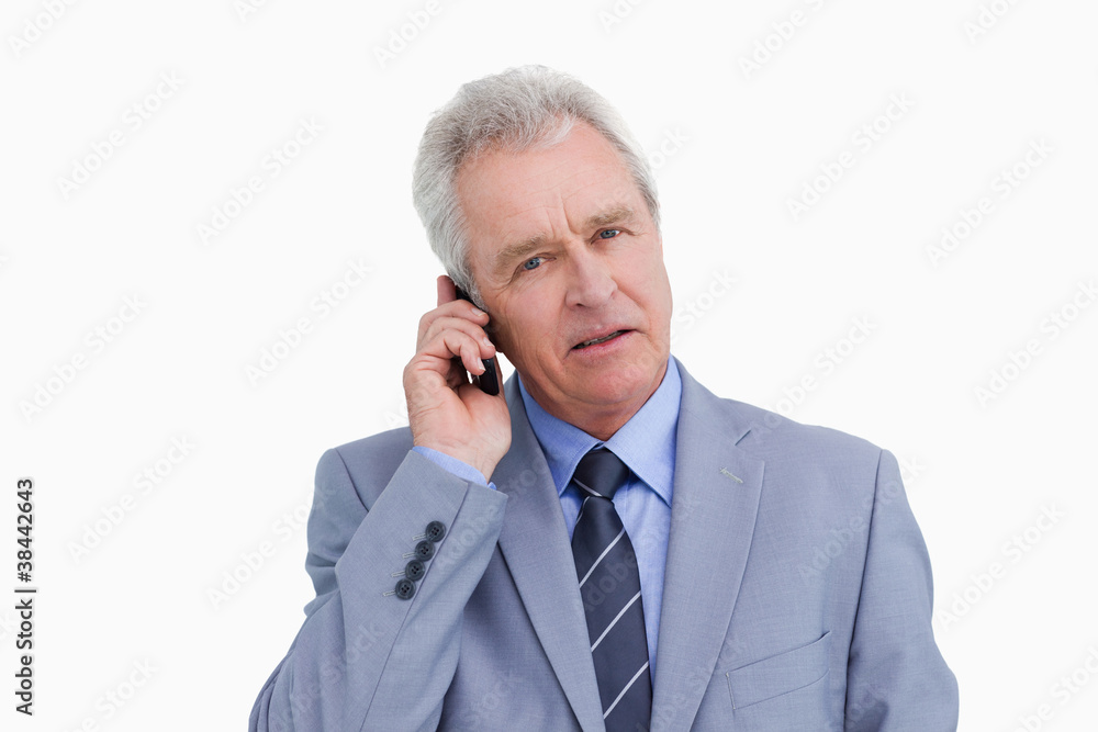 Close up of mature tradesman on his mobile phone Close up of mature tradesman on his mobile phone