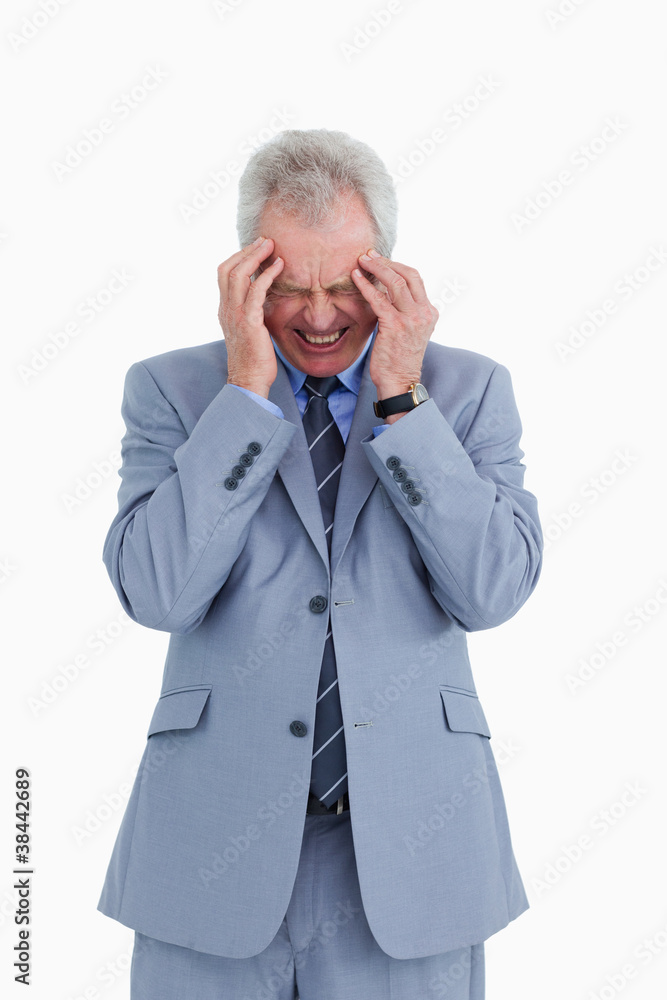 Mature tradesman experiencing a headache Mature tradesman experiencing a headache