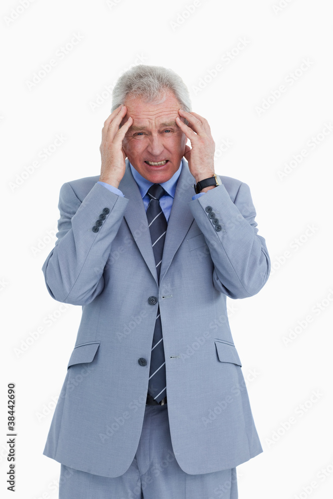 Mature tradesman having a headache Mature tradesman having a headache