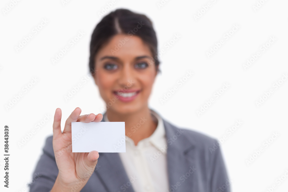 Smiling female entrepreneur showing her business card Smiling female entrepreneur showing her business card