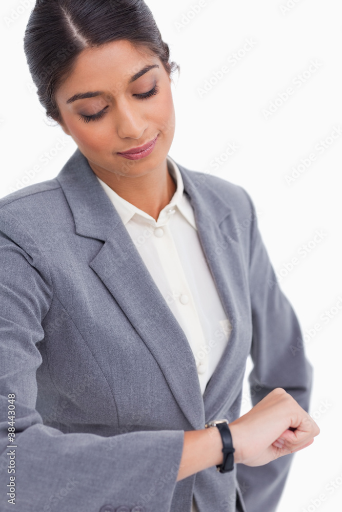 Close up of female entrepreneur looking at her watch Close up of female entrepreneur looking at her watch