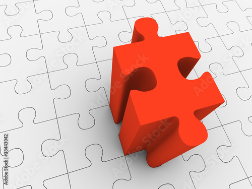 Red puzzle piece projecting from grey puzzle