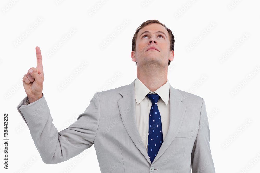 Close up of businessman pointing and looking up Close up of businessman pointing and looking up