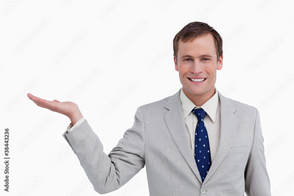 Close up of smiling businessman with his palm up Close up of smiling businessman with his palm up