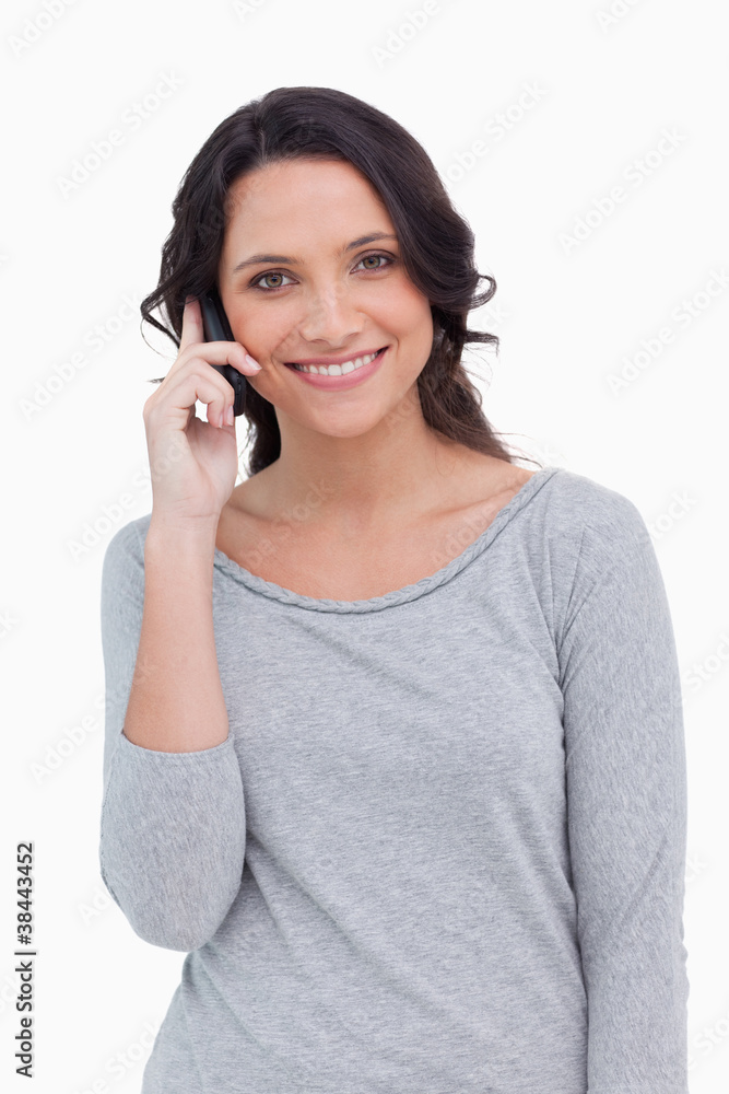 Close up of smiling woman on her cellphone Close up of smiling woman on her cellphone