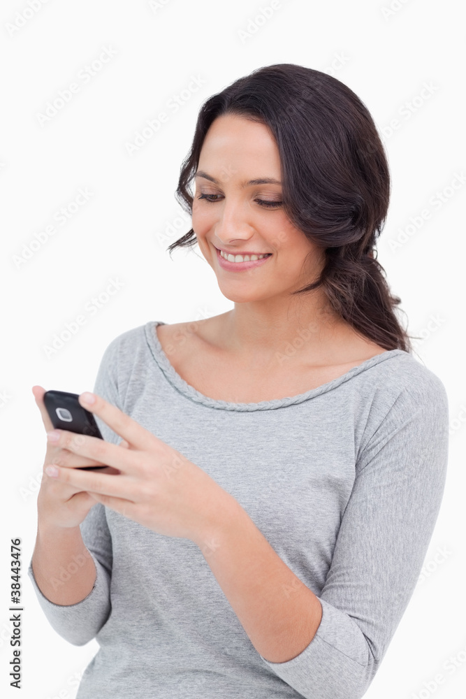 Close up of smiling woman reading text message Close up of smiling woman reading text message