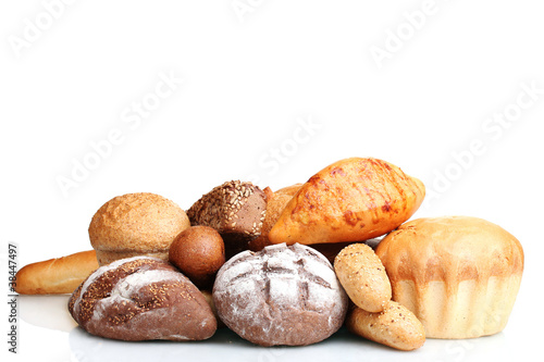 tasty breads and rolls isolated on white