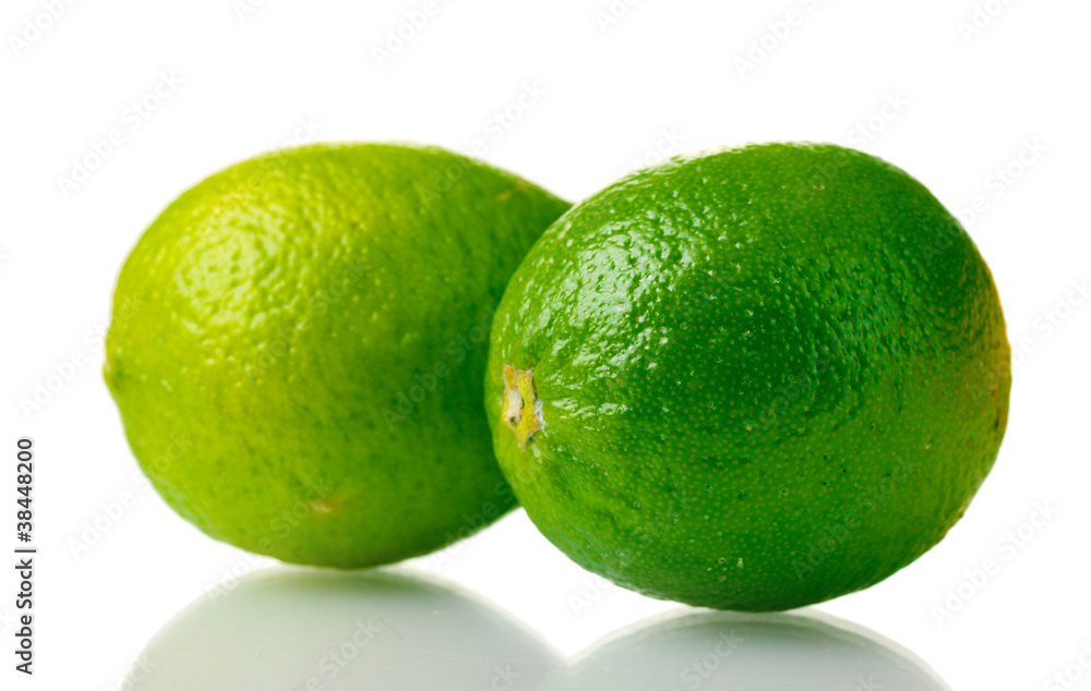 two ripe limes isolated on white two ripe limes isolated on white