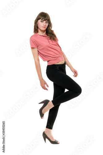 Young playful woman in a black leggings. Isolated