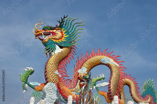 Colorful dragon statue on blue sky