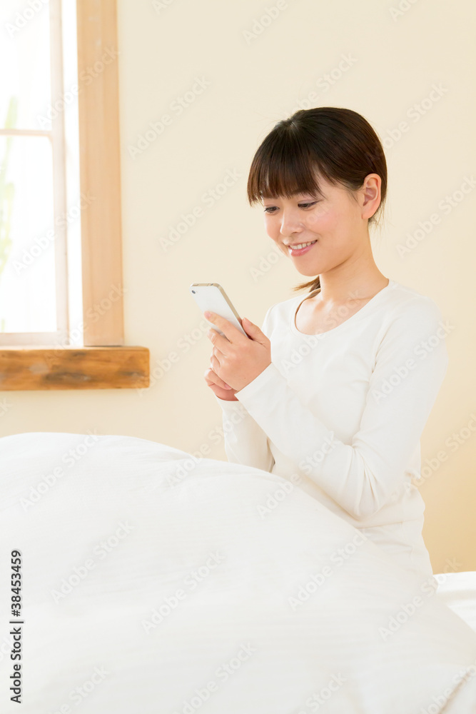 Asian beautiful woman using a mobile phone Asian beautiful woman using a mobile phone