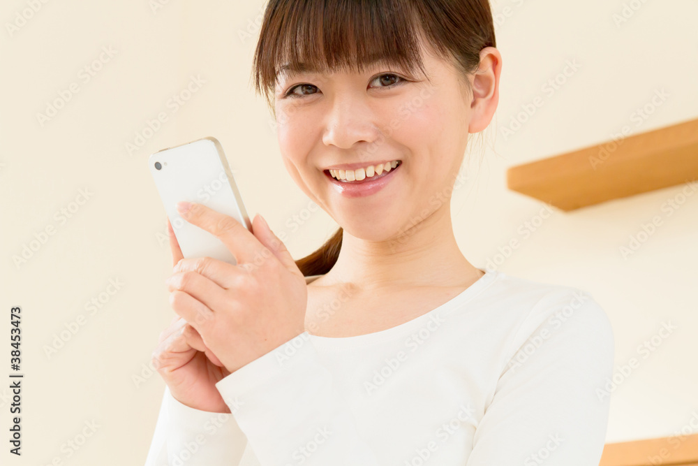 Asian beautiful woman using a mobile phone Asian beautiful woman using a mobile phone
