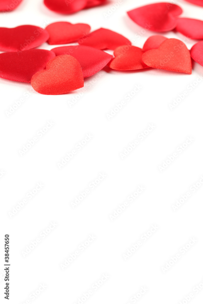 Border made of heart shaped decorations on white background