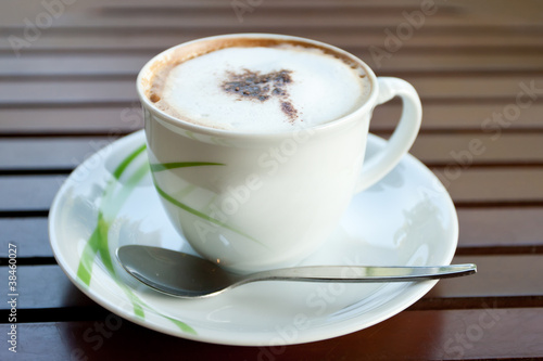 White cup cofee on wood table