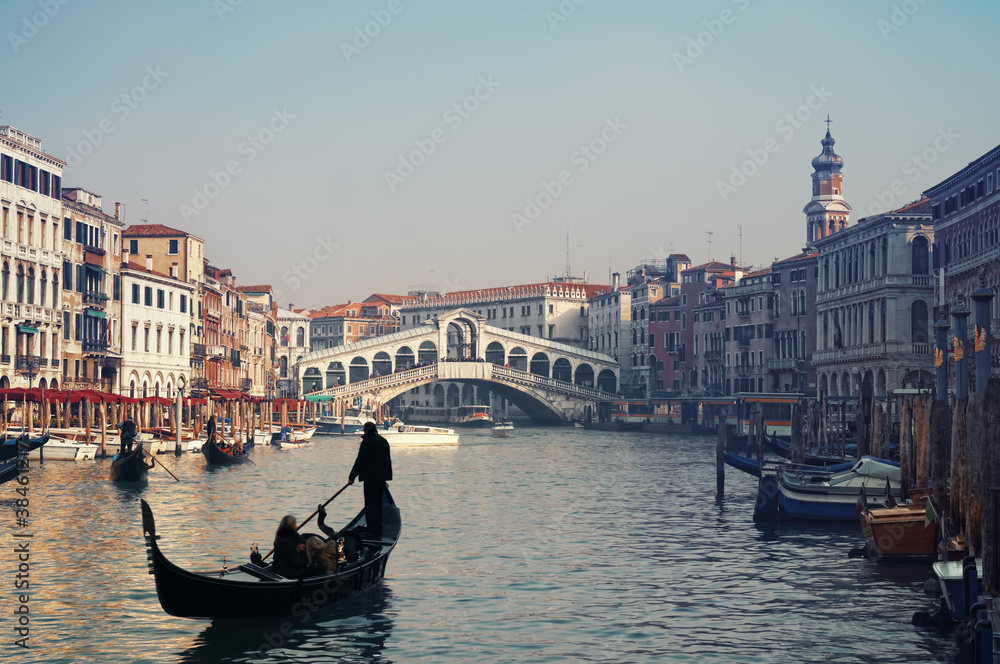 Rialto Bridge and gondolas  in Venice.