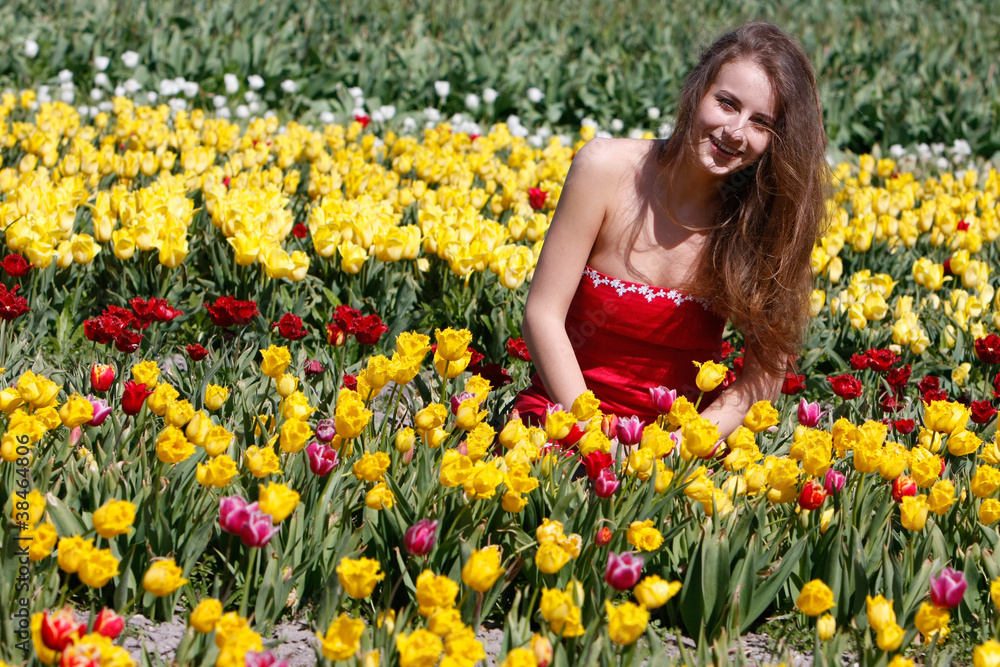 young happy woman in tulip field young happy woman in tulip field