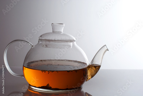 transparent teapot with herb tea
