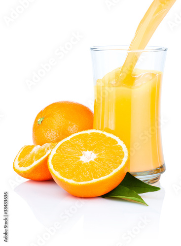 Fresh Oranges Juice Pouring into a Glass Isolated on white backg