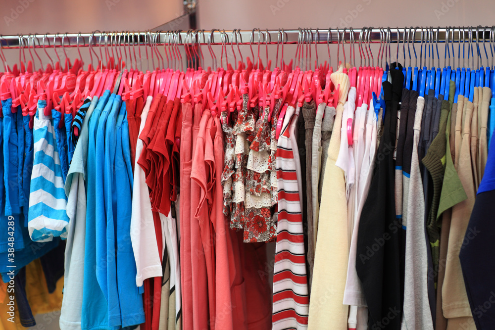 Colourful clothes on hangers Colourful clothes on hangers