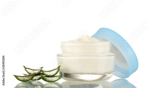 Opened glass jar of cream and aloe isolated on white