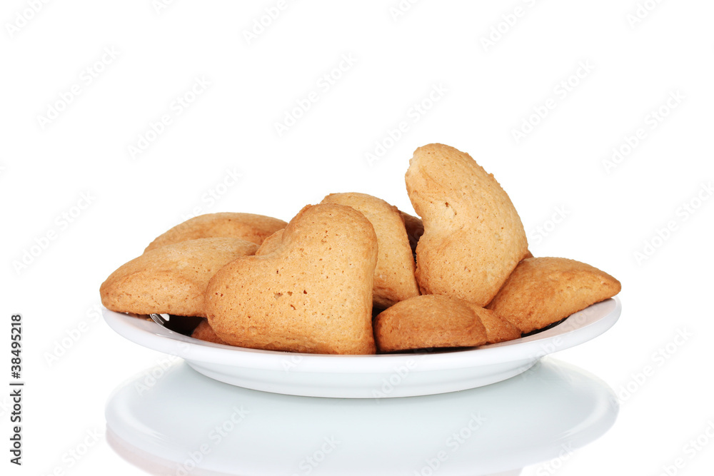 Heart-shaped cookies on white plate isolated on white Heart-shaped cookies on white plate isolated on white