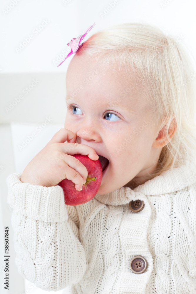 small happy girl on a white background. Studio shooting small happy girl on a white background. Studio shooting