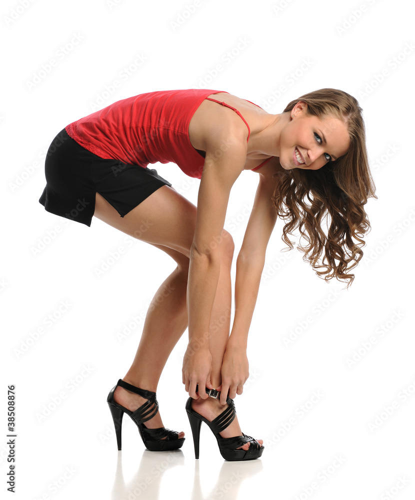 Young Woman Tying Shoe Young Woman Tying Shoe