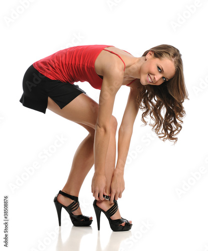 Young Woman Tying Shoe
