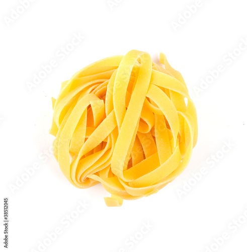 A portion of tagliatelle italian pasta isolated on white